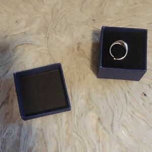 Silver Band Ring in Navy Jewelry Box says f**k in script